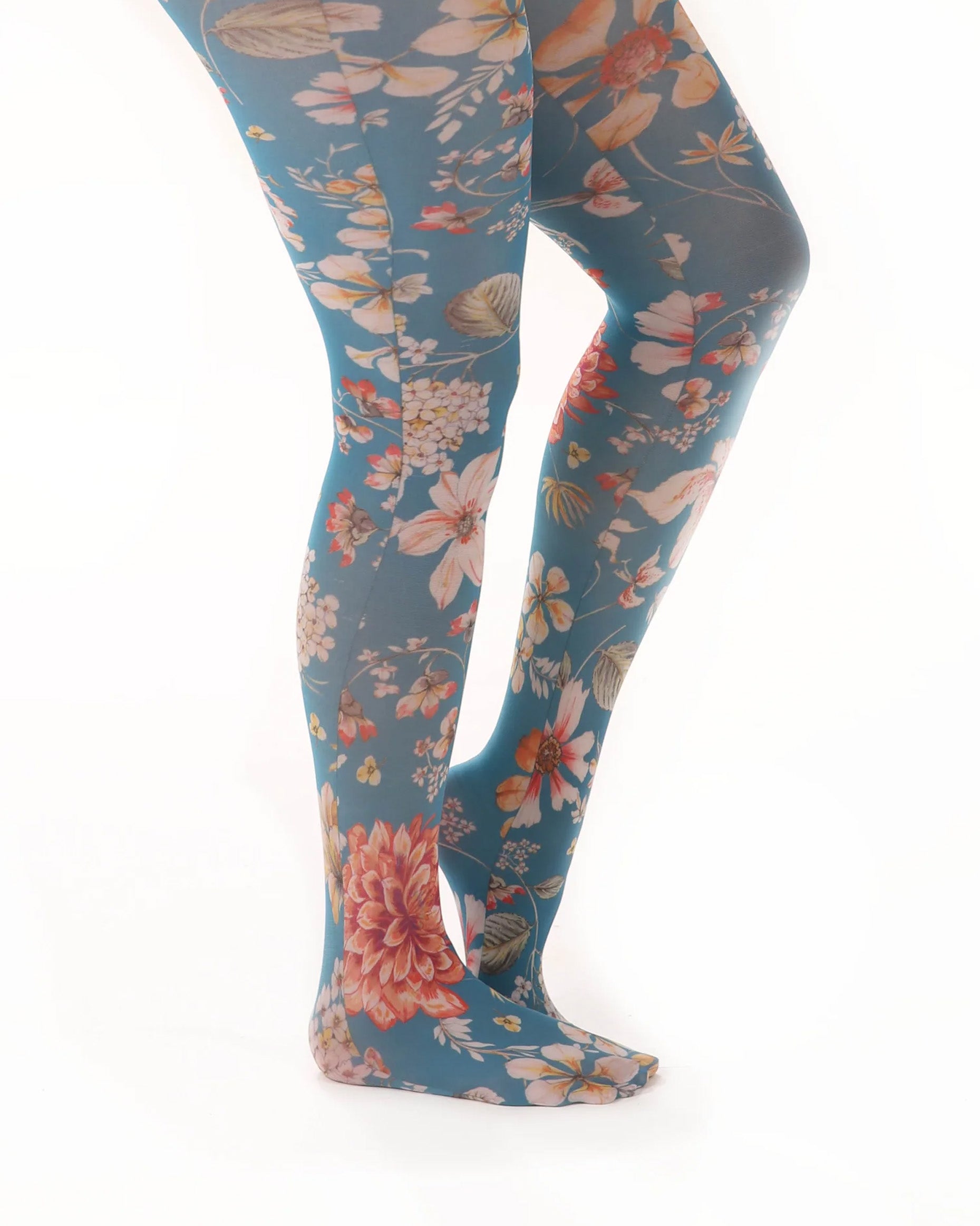 Pamela Mann Exotic Floral Print Tights - White opaque fashion tights with a floral printed pattern with teal blue background and multicoloured flowers. Side view.