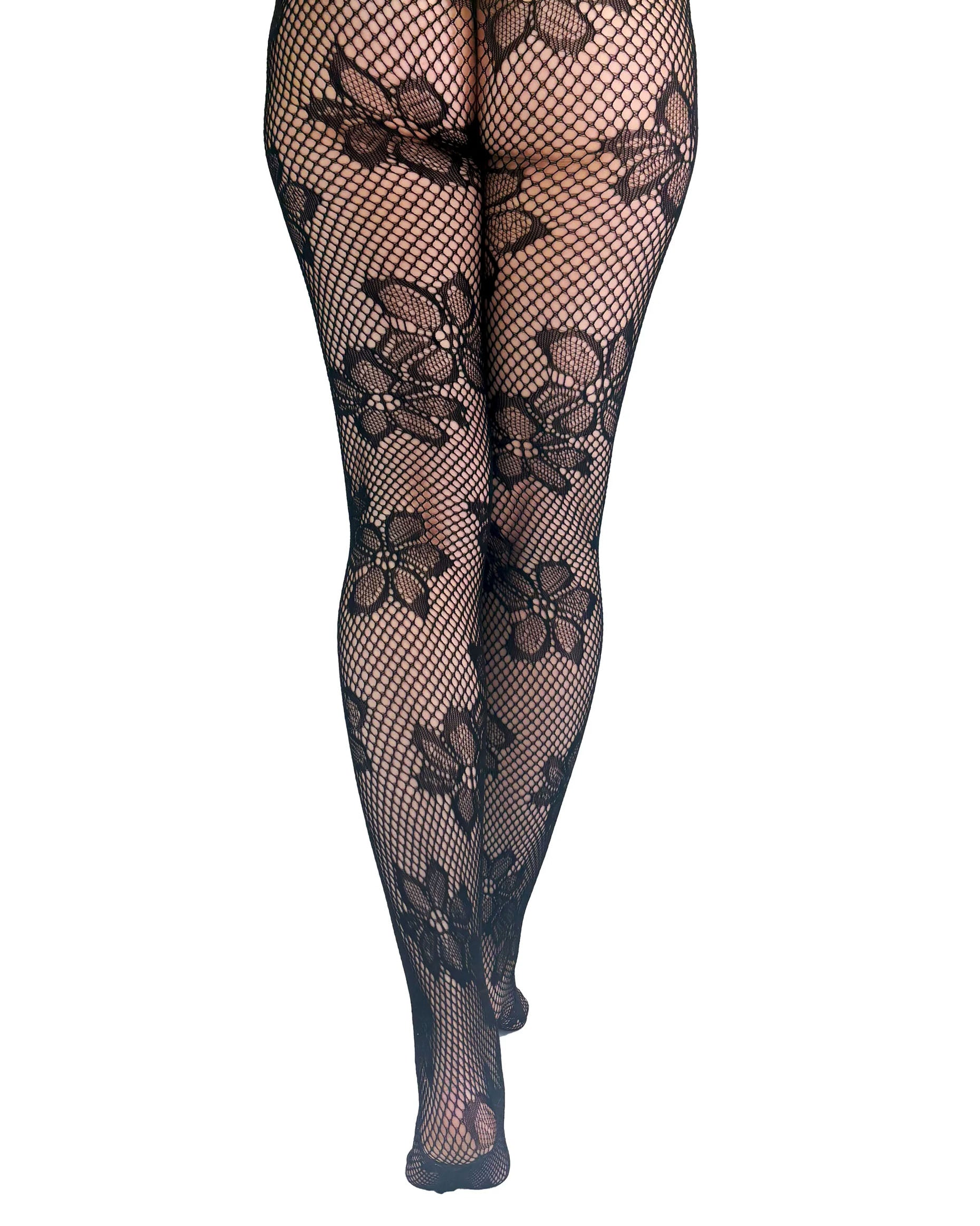 Pamela Mann Blossom Net Tights - Black openwork seamless fishnet tights with a floral design pattern. Back view.