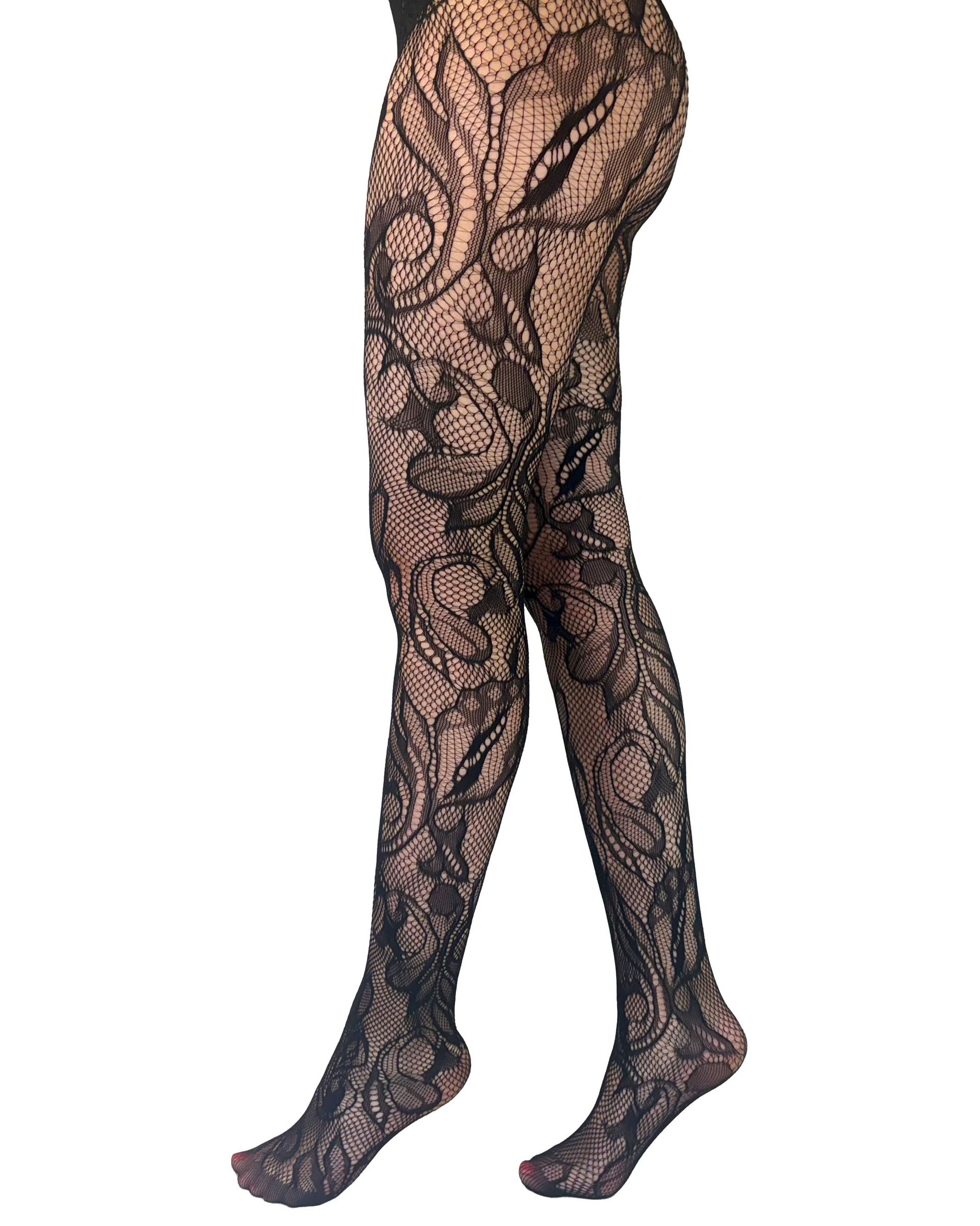Pamela Mann Botanical Lace Tights - Black net design tights featuring an abstract leaf pattern that wraps around the leg and has reinforced toes, side view.