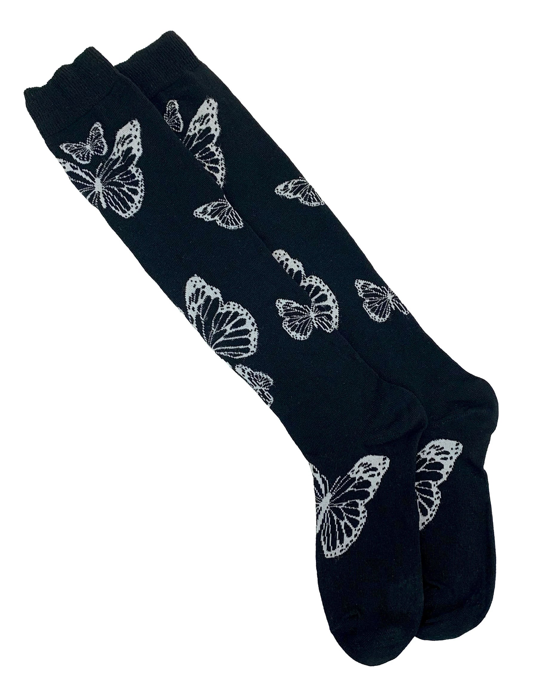 Soft cotton mix black knitted over-knee socks with white butterfly motif pattern that flutters up the leg and deep elasticated cuff.