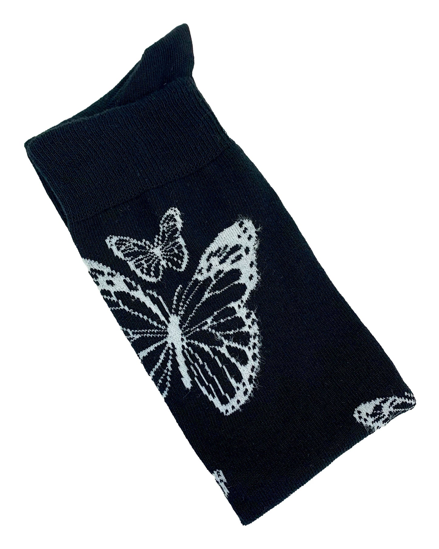 Soft cotton mix black knitted over-knee socks with white butterfly motif pattern that flutters up the leg and deep elasticated cuff. Folded view.