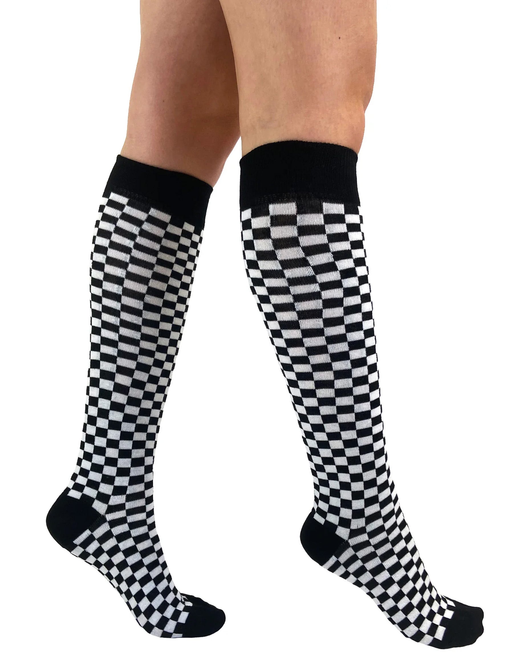 Pamela Mann Checkered Knee-Highs - Black and white checkered square patterned knee-high cotton socks with black cuff, toe and heel. Side view.