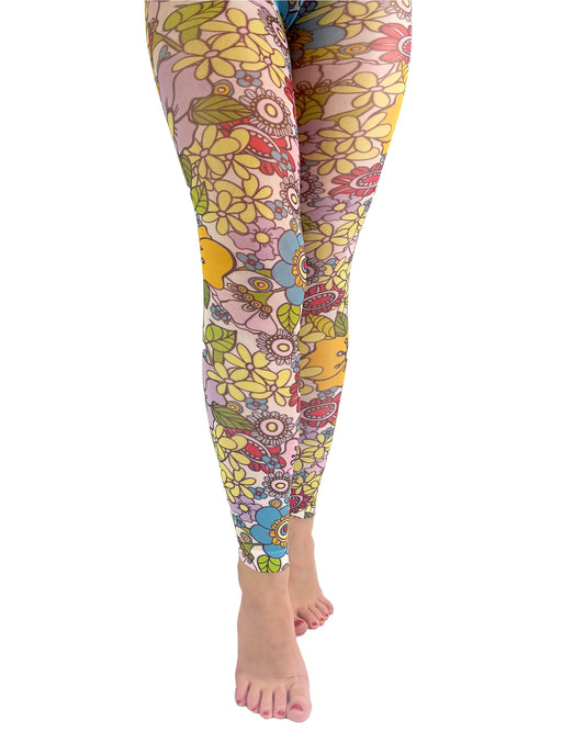 Pamela Mann Flower Power Footless Tights - Pale pink opaque footless tights with a sixties style flower print pattern in bright shades of purple, yellow, blue, red, pink, orange and outlined in black.