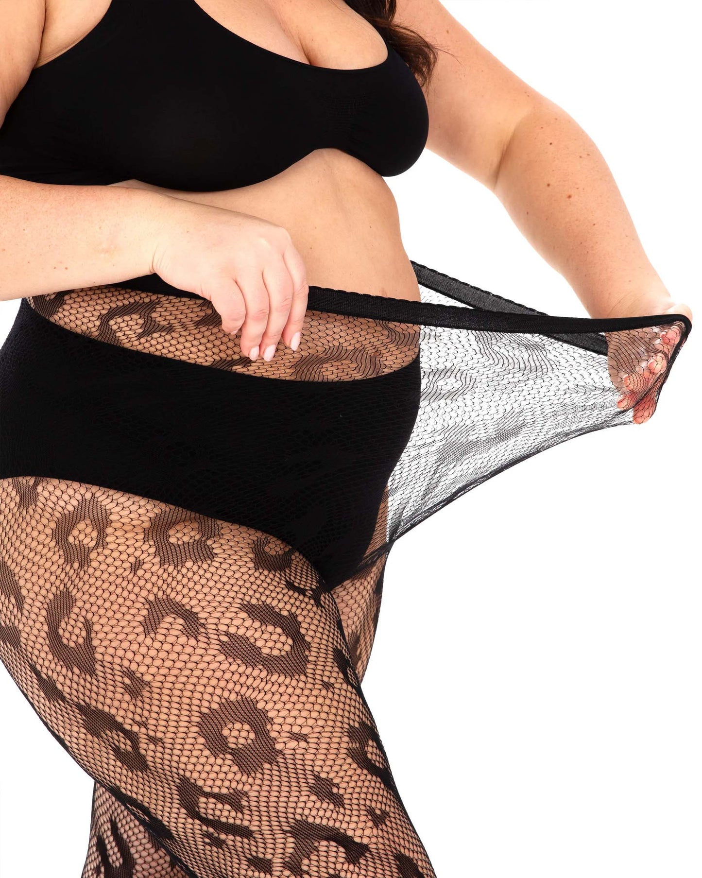Black super stretch plus size seamless fishnet tights with a leopard print style pattern. Pulling the waist.