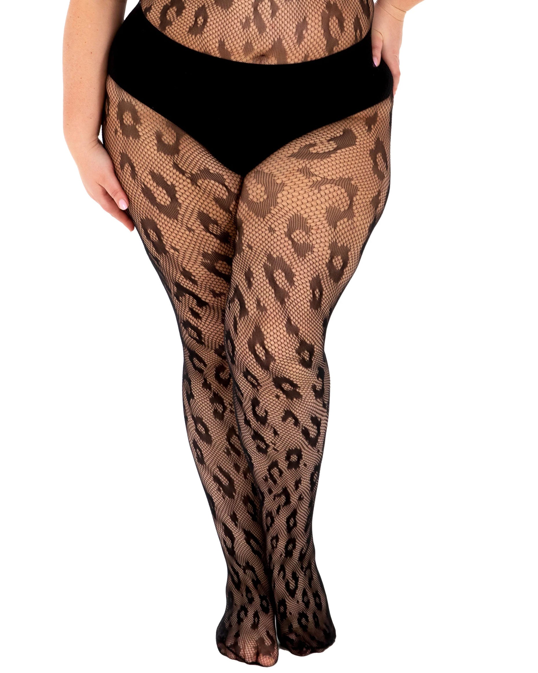 Leopard print fishnet tights worn by a plus size model wearing black panty briefs.