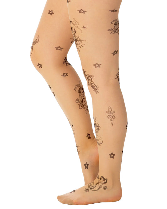 Pamela Mann Tattoo Sailor Girl Tights - nude tights with black nautical tattoo patterned print, side view