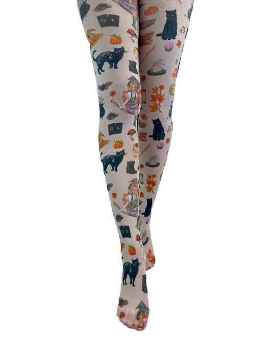 Pamela Mann Spells & Potion Tights - White opaque tights with an all over print of Victorian style Halloween themed illustrations, including pumpkins, cats, witches hats, broom sticks, cauldrons etc.