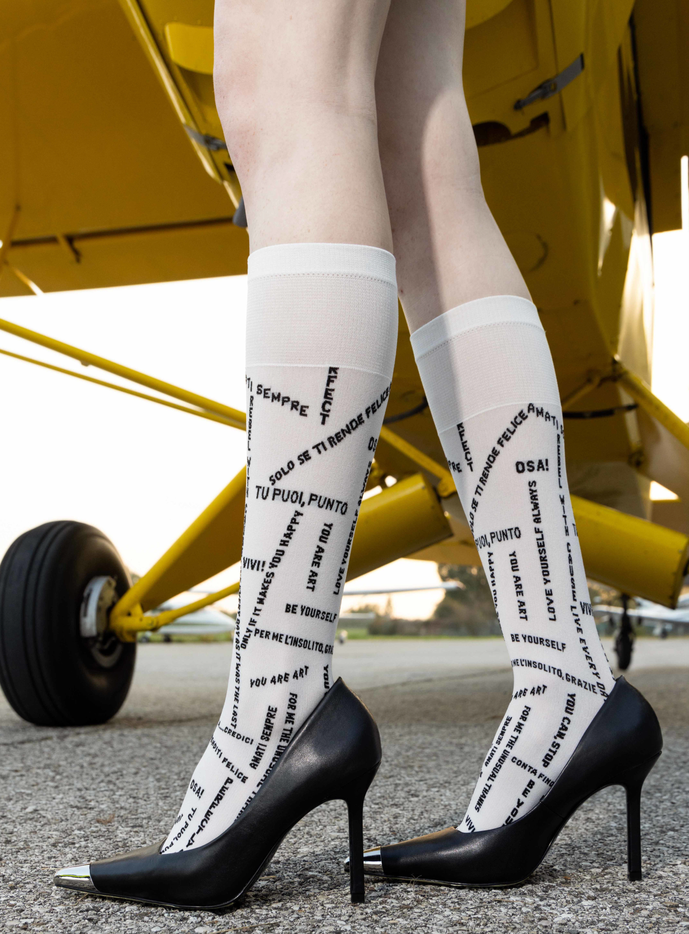 Trasparenze Las Vegas Knee-High Socks - White opaque fashion knee-high socks with slogans and motivational text woven pattern in black in other languages.