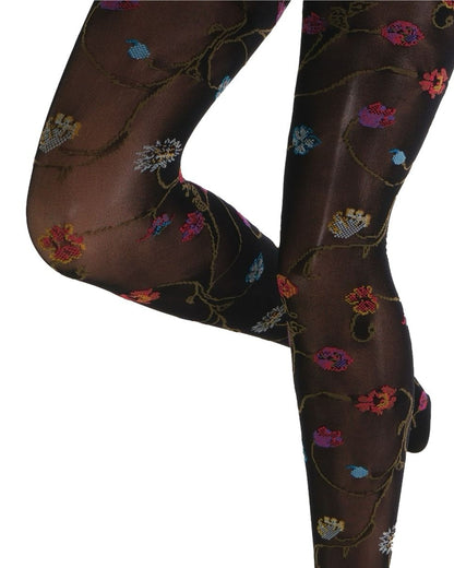 Black coloured tights with a colourful floral patterned (close up detail) on a white background