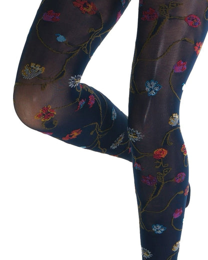 Navy blue coloured tights with a colourful floral patterned (close up detail) on a white background