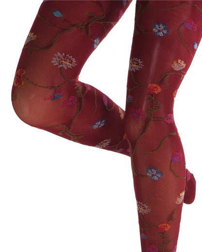 Maroon coloured tights with a colourful floral patterned (close up detail) on a white background