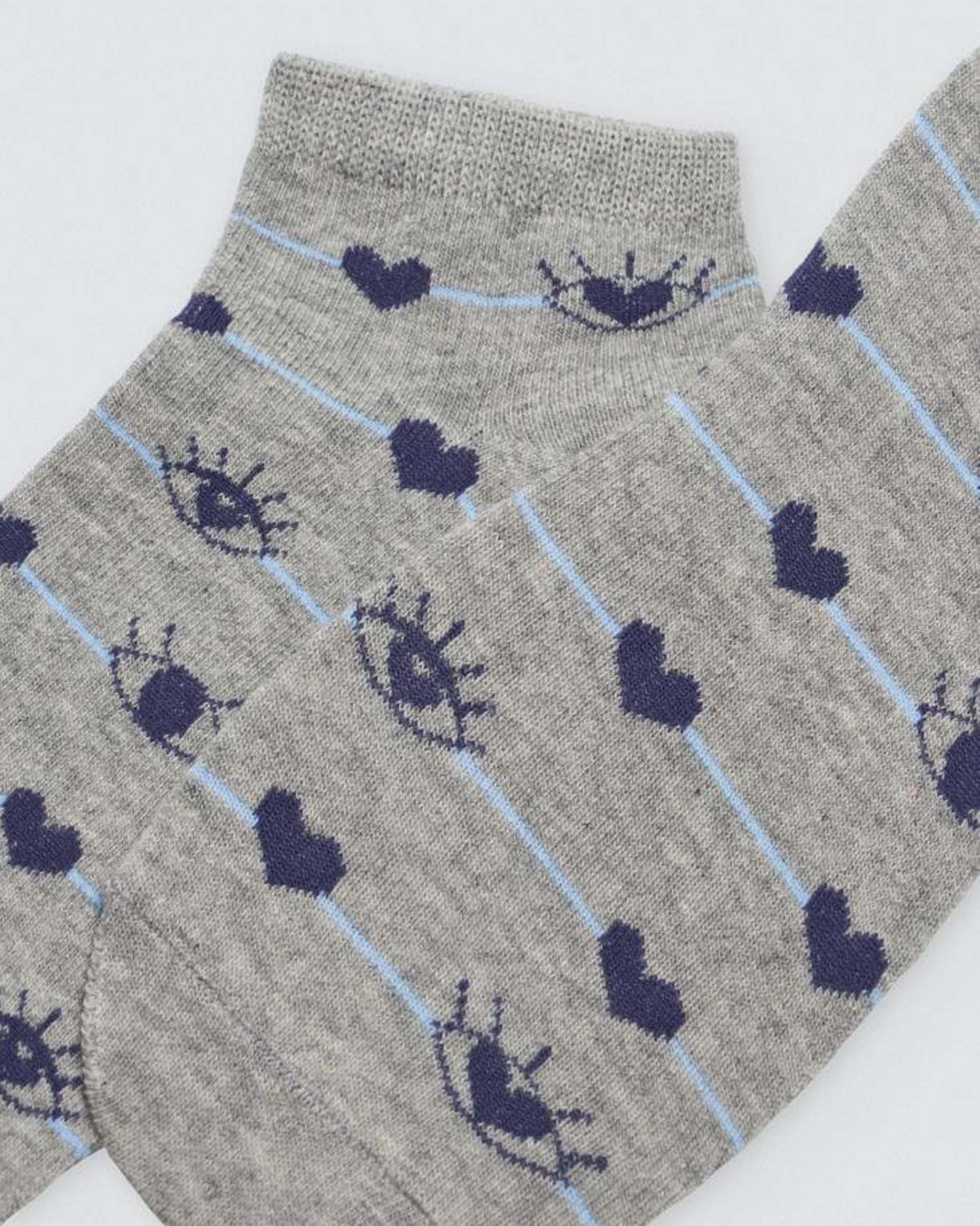 Ysabel Mora Heart & Eye Socks - Low ankle cotton socks with a navy heart and eyes pattern on a thin light blue stripe. Close up.