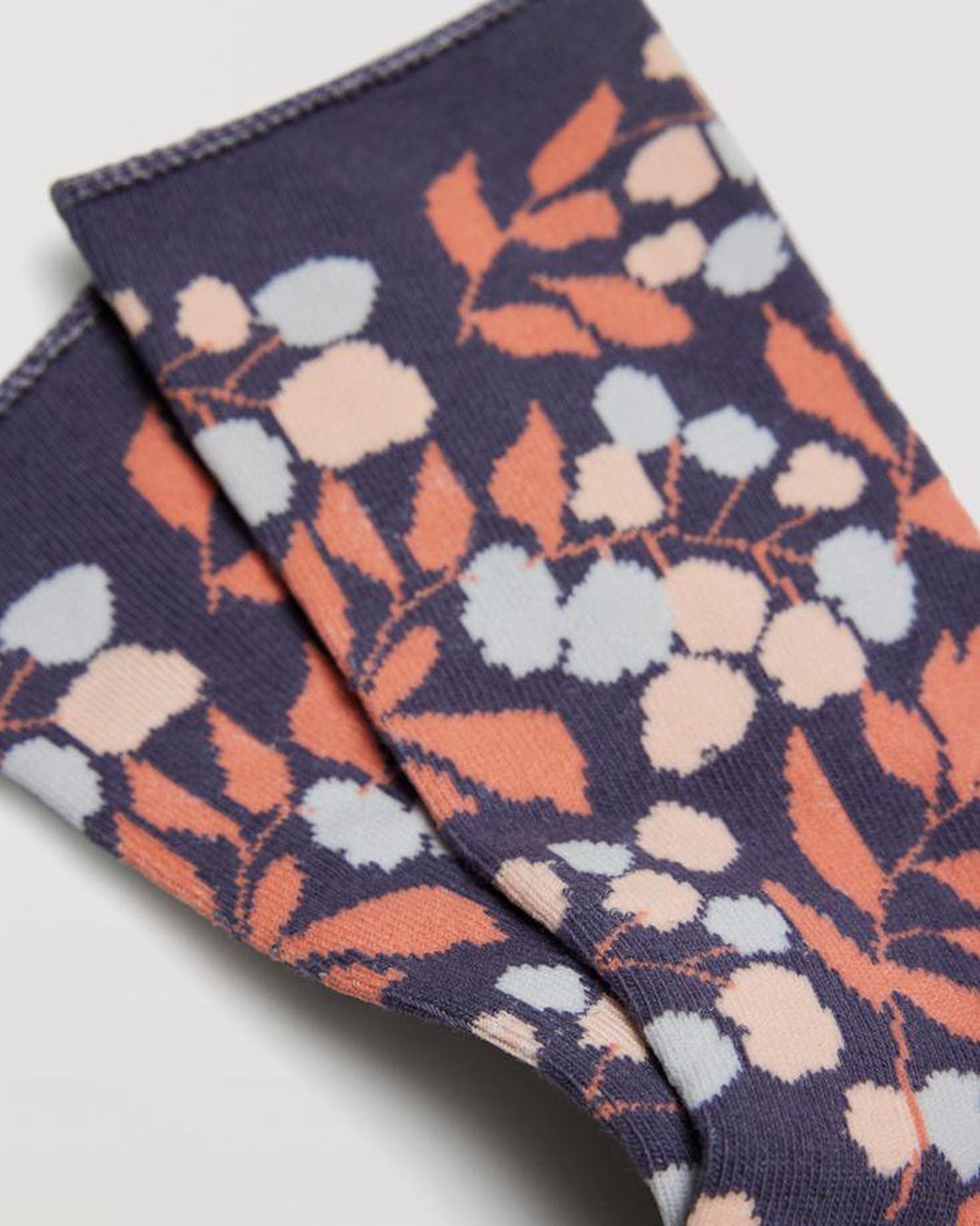 Ysabel Mora 12876 Floral Leaf Sock - Denim blue cotton crew socks with an all over leaf and floral pattern in shades of peach and light blue and no cuff soft edge roll.