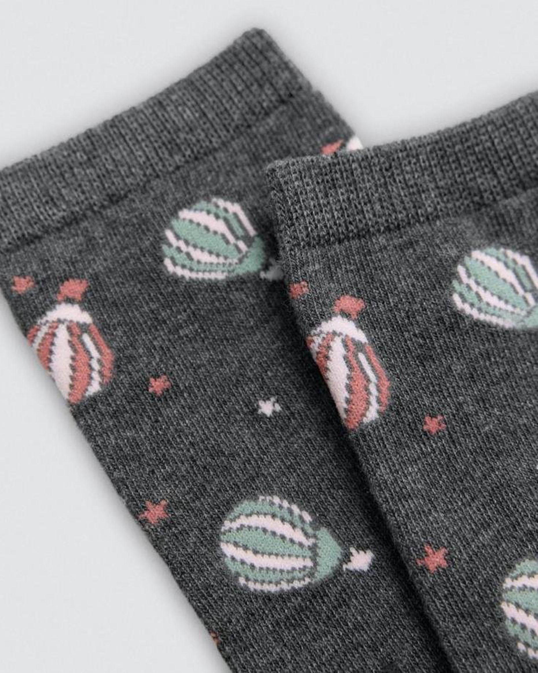 Grey socks with hot air balloon pattern on a light grey background