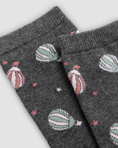 Grey socks with hot air balloon pattern on a light grey background
