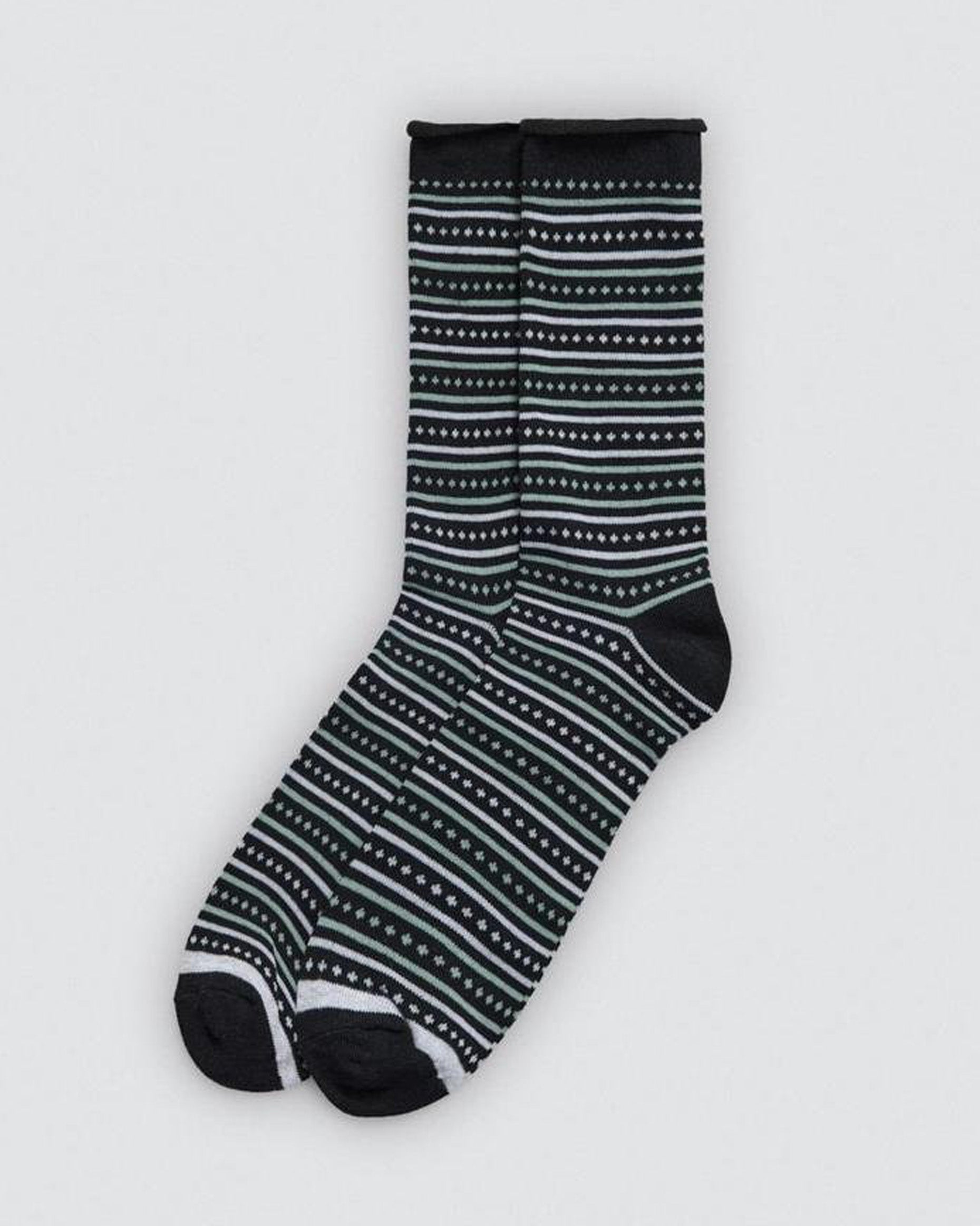 Black and white striped sock on a light gray background