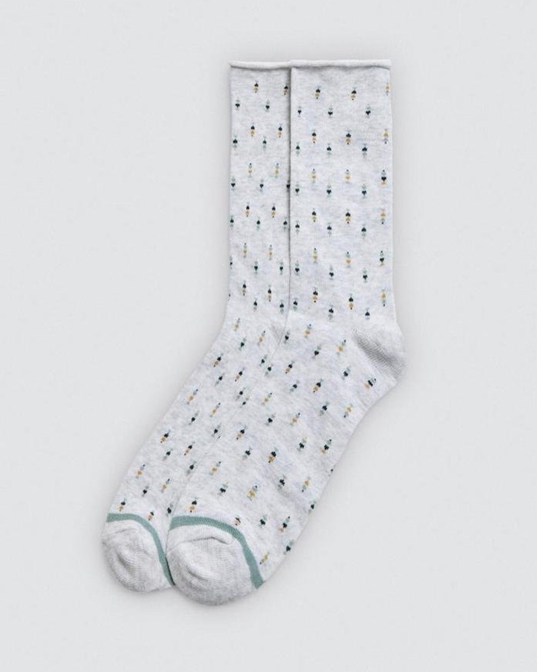 Light grey sock with small pattern on a light grey background