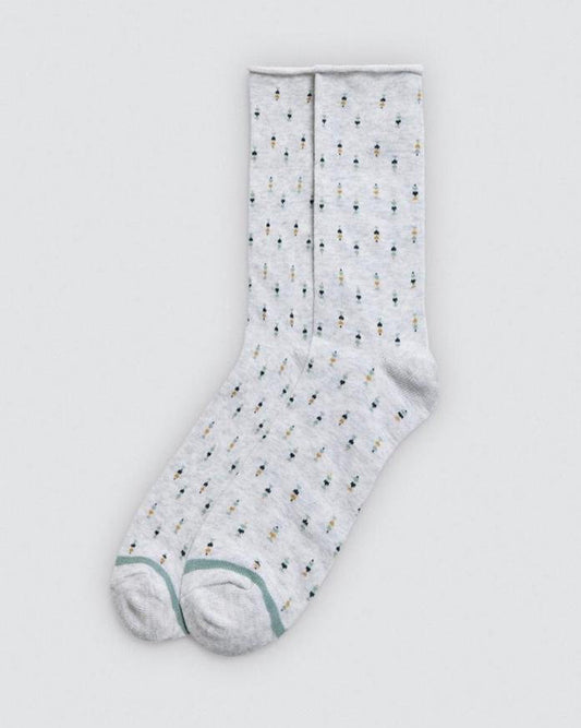 Light grey sock with small pattern on a light grey background