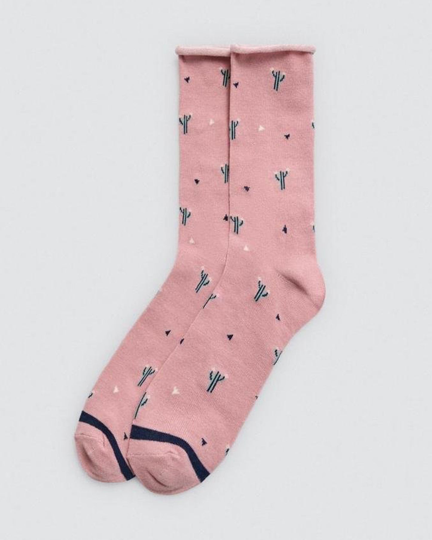 Pink sock with cactus pattern on a light gray background