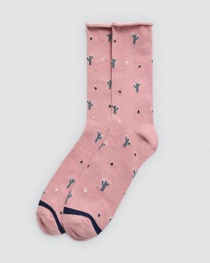 Pink sock with cactus pattern on a light gray background