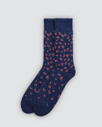 Navy sock with pink leopard print pattern on a light gray background