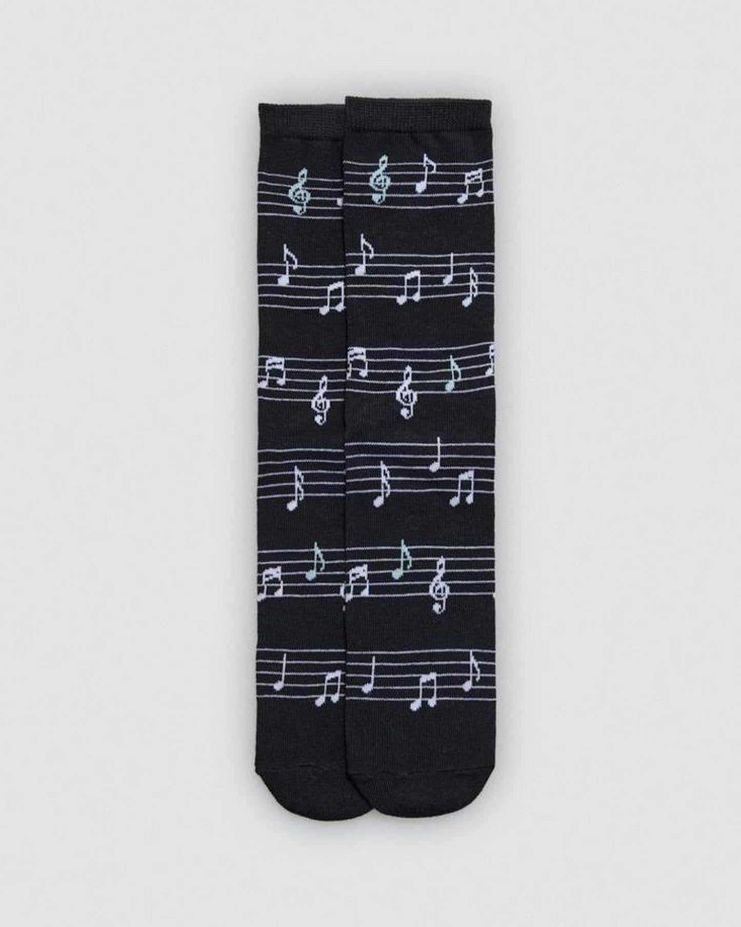 Black socks with white musical note pattern on a light gray background