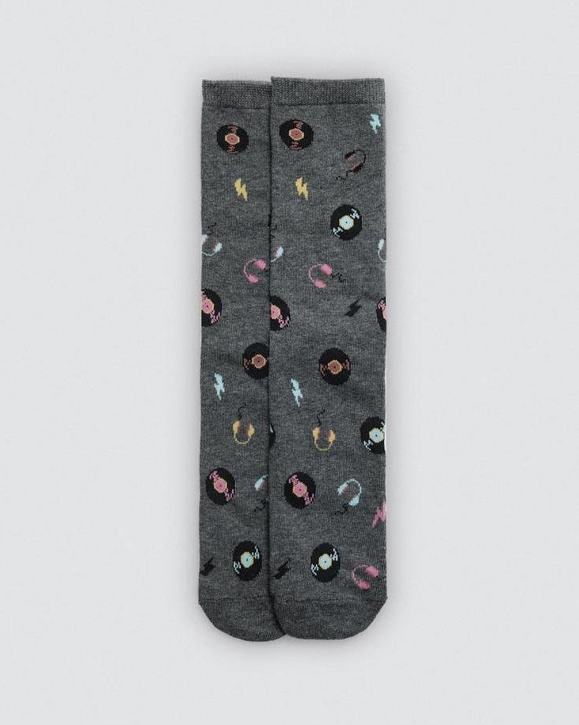 Grey socks with a colourful vinyl records, headphones and lightning bolts pattern on a light grey background