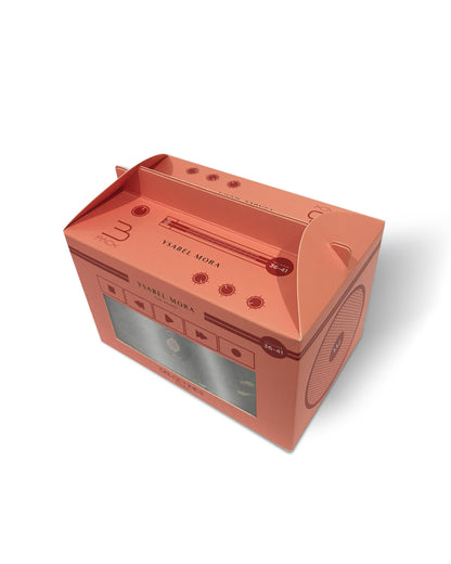 Coral-colored cassette tape-shaped gift box on a white background