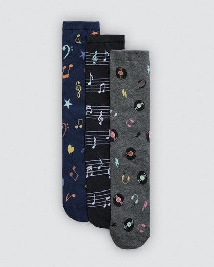 Three pairs of socks with musical note patterns on a light gray background