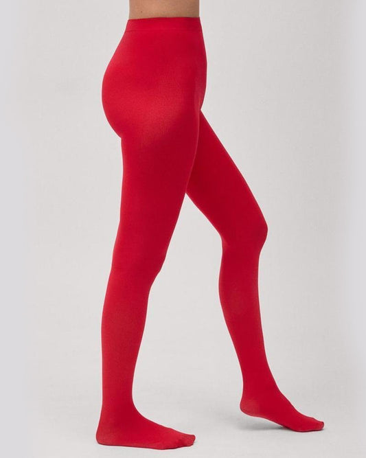 Red opaque tights worn by a model with light grey backdrop