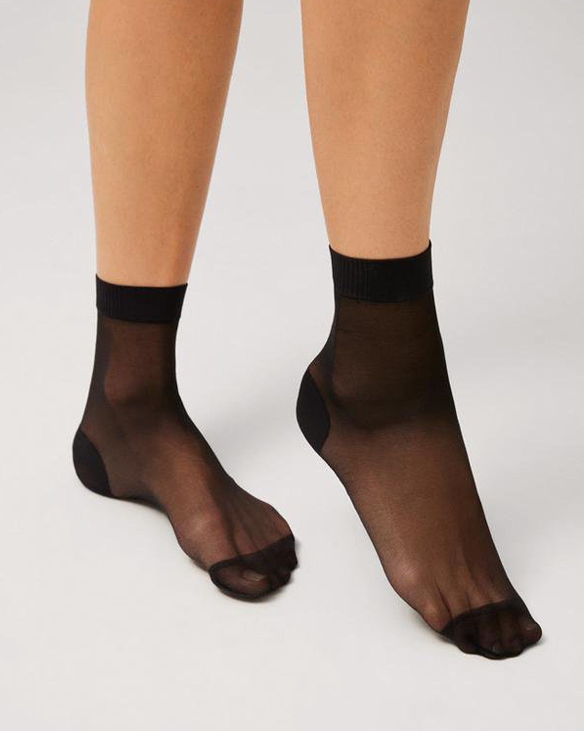 Ysabel Mora 18114 Sheer Reinforced Ankle Socks - Sheer black ankle sock with an opaque reinforced toe and heel and soft ribbed anti-pressure comfort cuff.