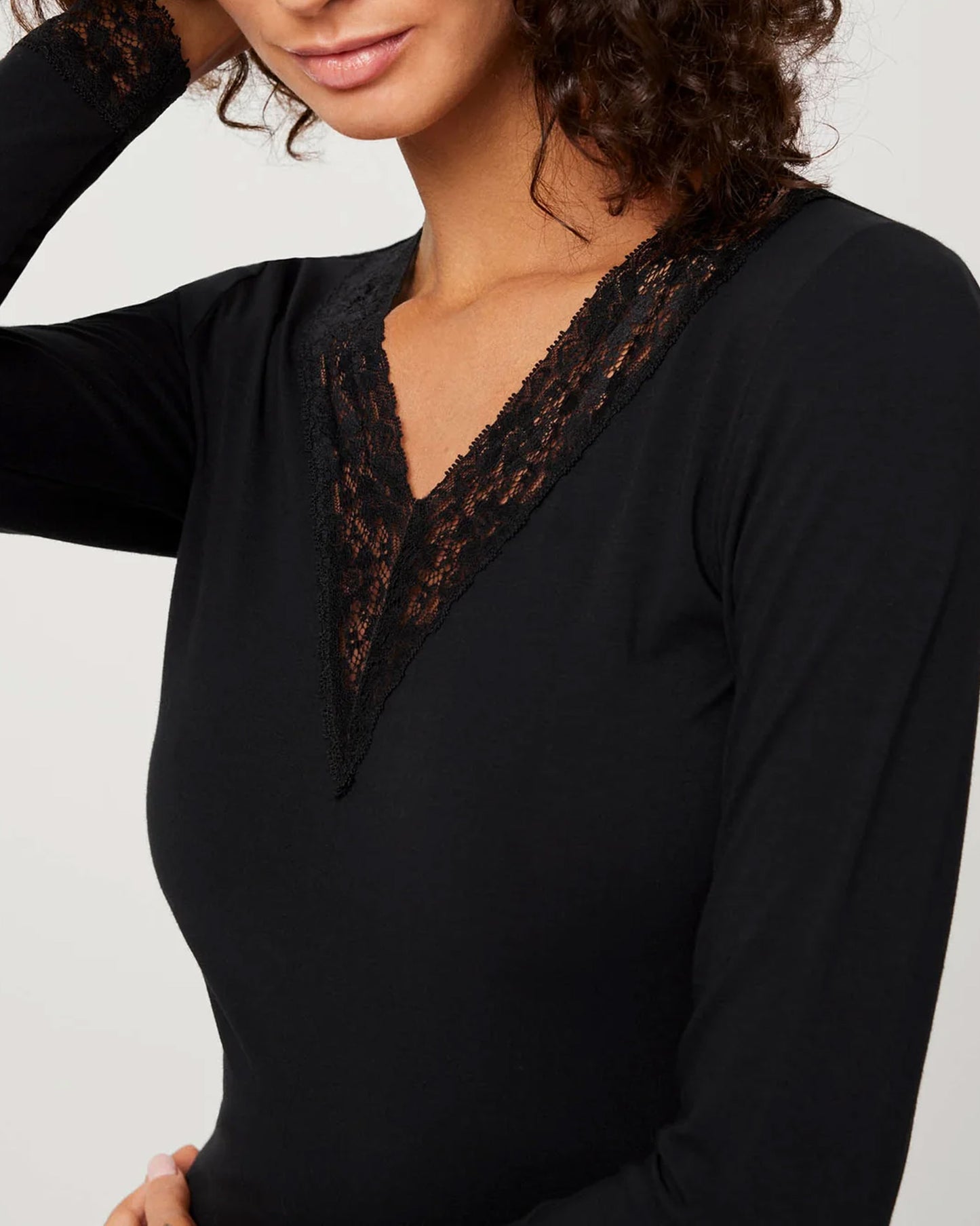 Ysabel Mora 19532 Lace Trim Top - Soft and light long sleeved black cotton top with a lace trim v-neck and floral lace trim cuffs.