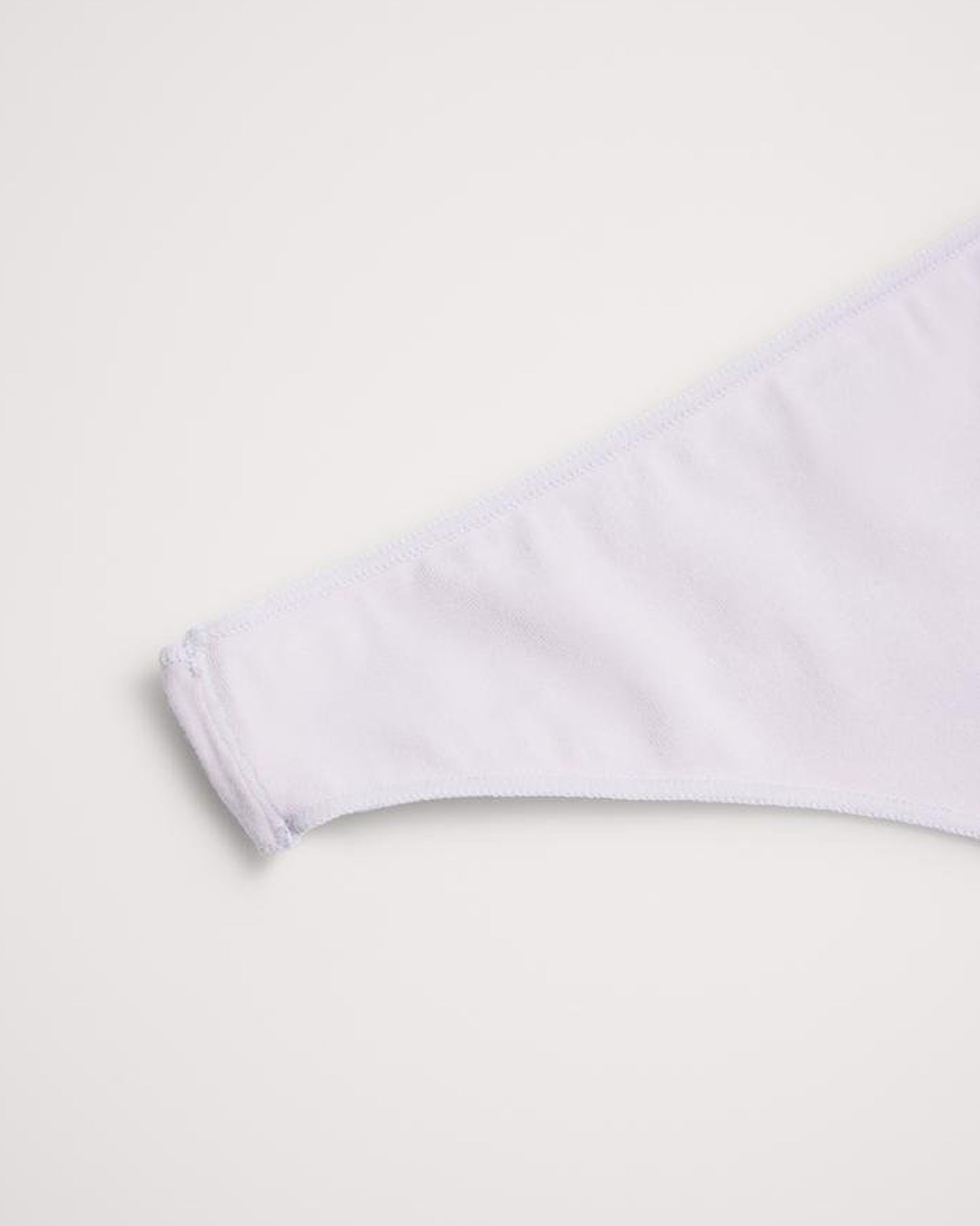 White thong underwear on a light grey background