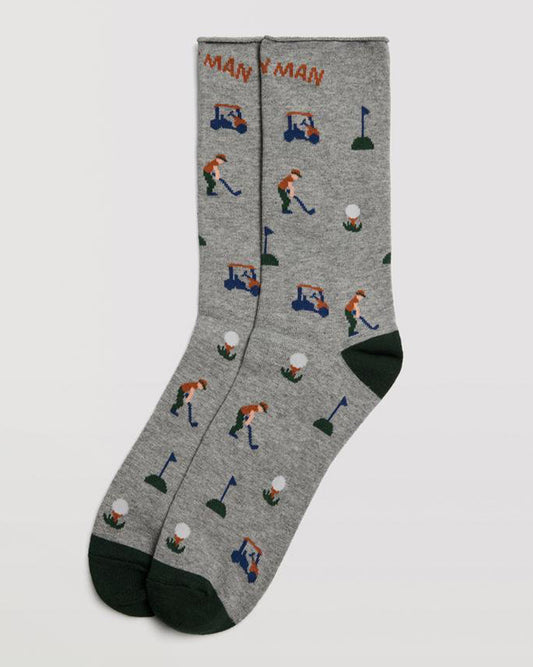 Ysabel Mora 22882 Golf Sock - Light grey cotton mix crew length ankle socks with a golf themed pattern of a golfer, golf ball, buggy and flags, the words "caddy man" on the front and a no cuff roll top edge.
