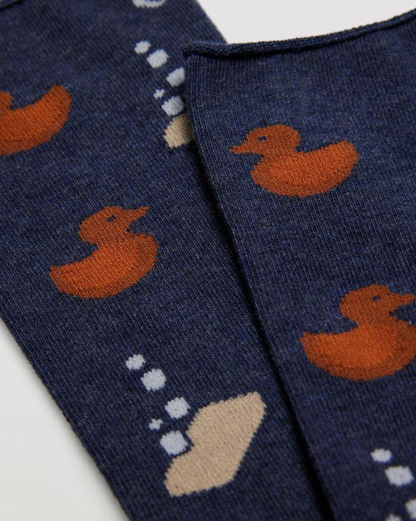 Denim blue cotton mix crew length ankle socks with a rusty orange rubber duck and sudsy soap pattern, black heel and toe and no cuff comfort top.
