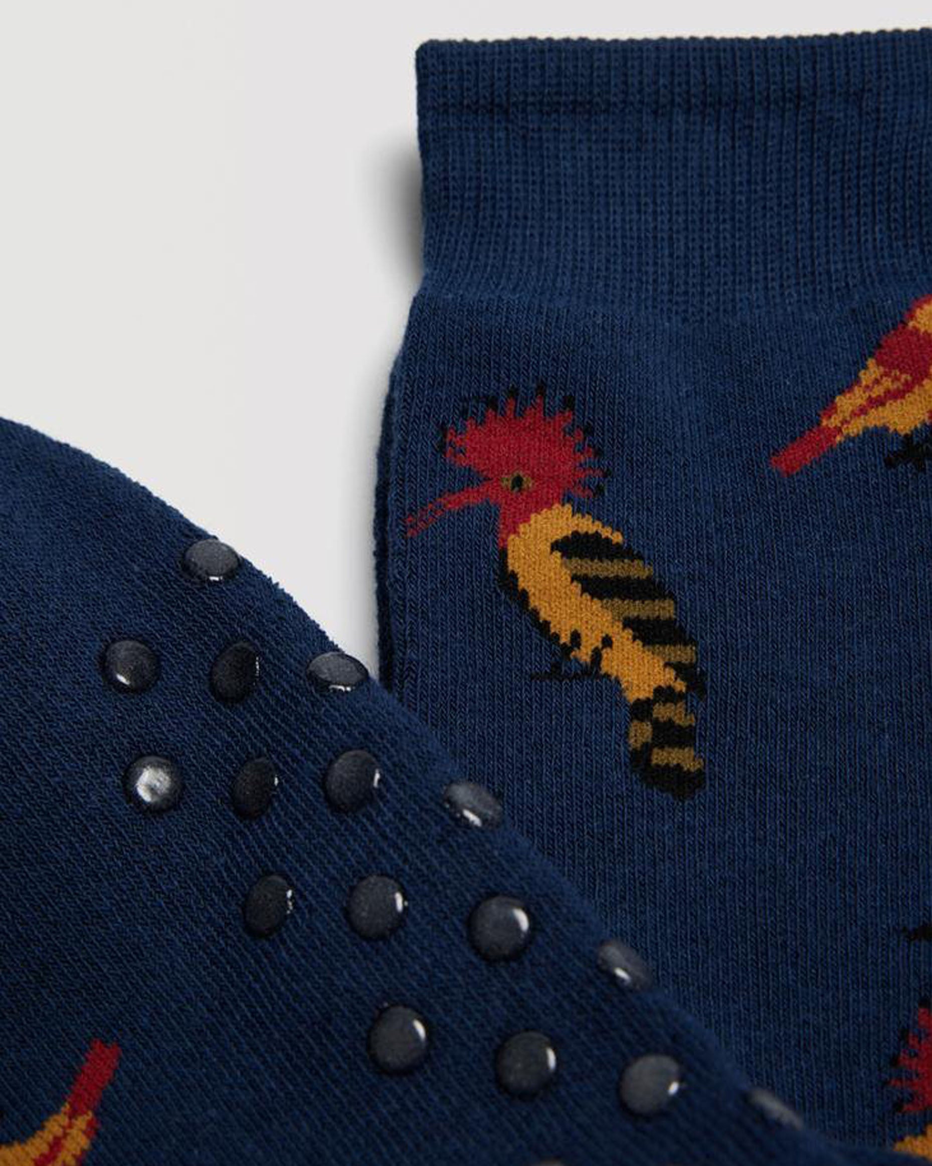 Ysabel Mora 22888 Bird Slipper Socks - Navy blue thick and warm terry lined cotton mix crew length ankle socks with an all over exotic birds pattern in red, mustard, brown and black, dotted non-slip sole and deep elasticated comfort cuff.