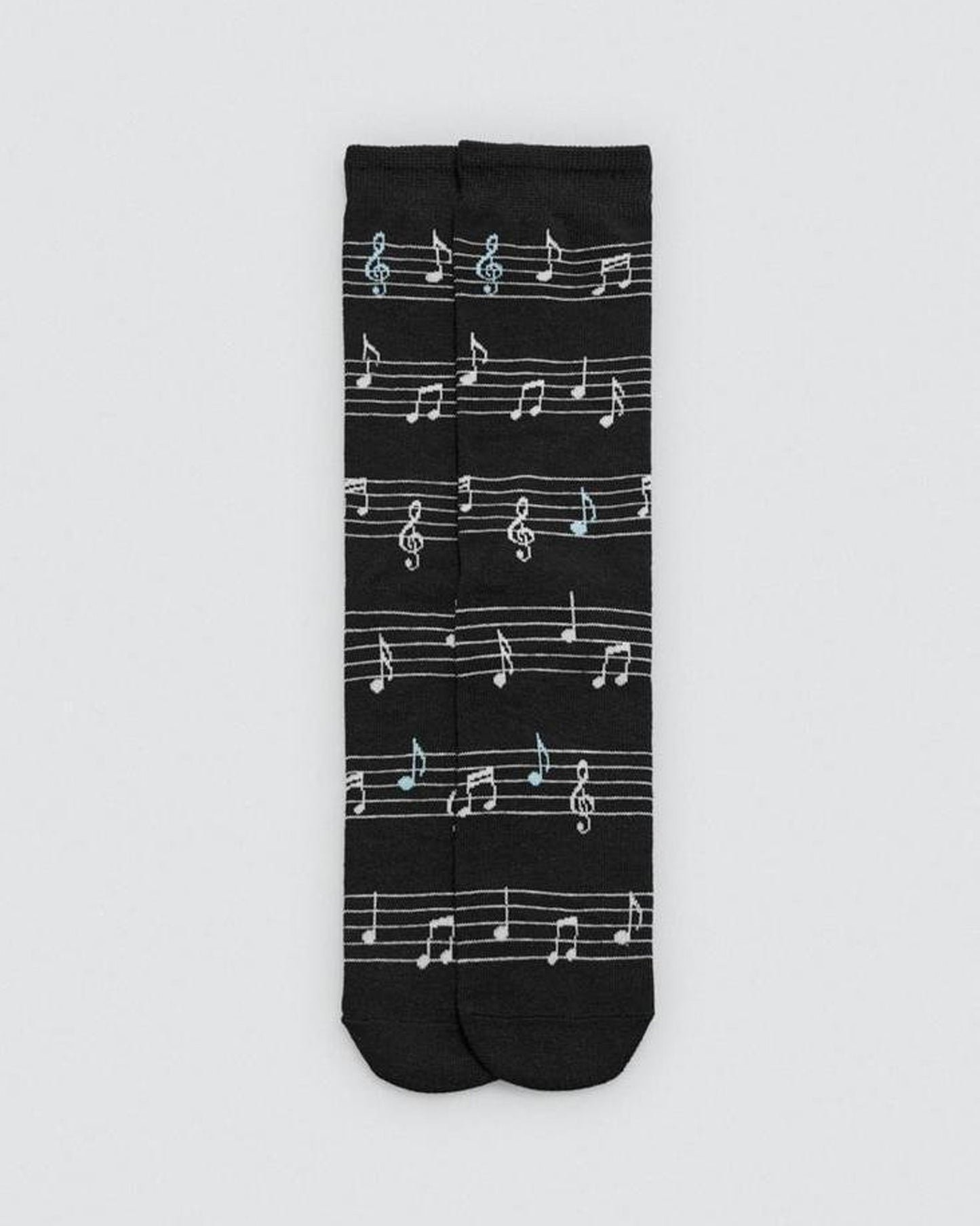 Black sock with white musical note pattern on a light gray background