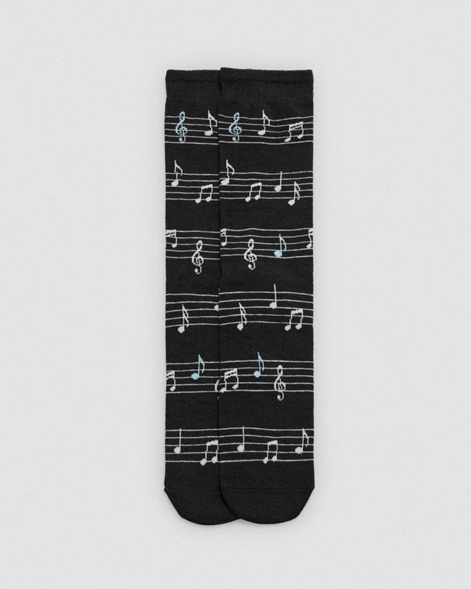 Black sock with white musical note pattern on a light gray background