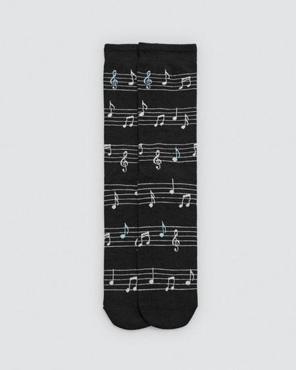 Black sock with white musical note pattern on a light gray background