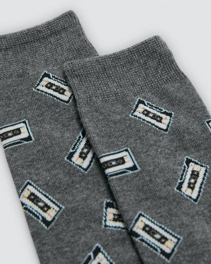 Gray socks with cassette tape pattern on a white background