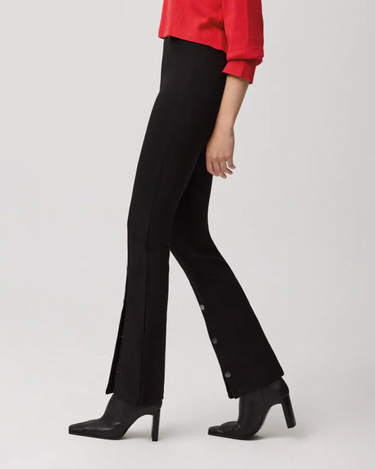 Ysabel Mora 70153 Flared Button Leggings - Black high waisted stretch trouser leggings (treggings) with split buttoned flare bottom. Worn with red sweater and black ankle heeled boots.