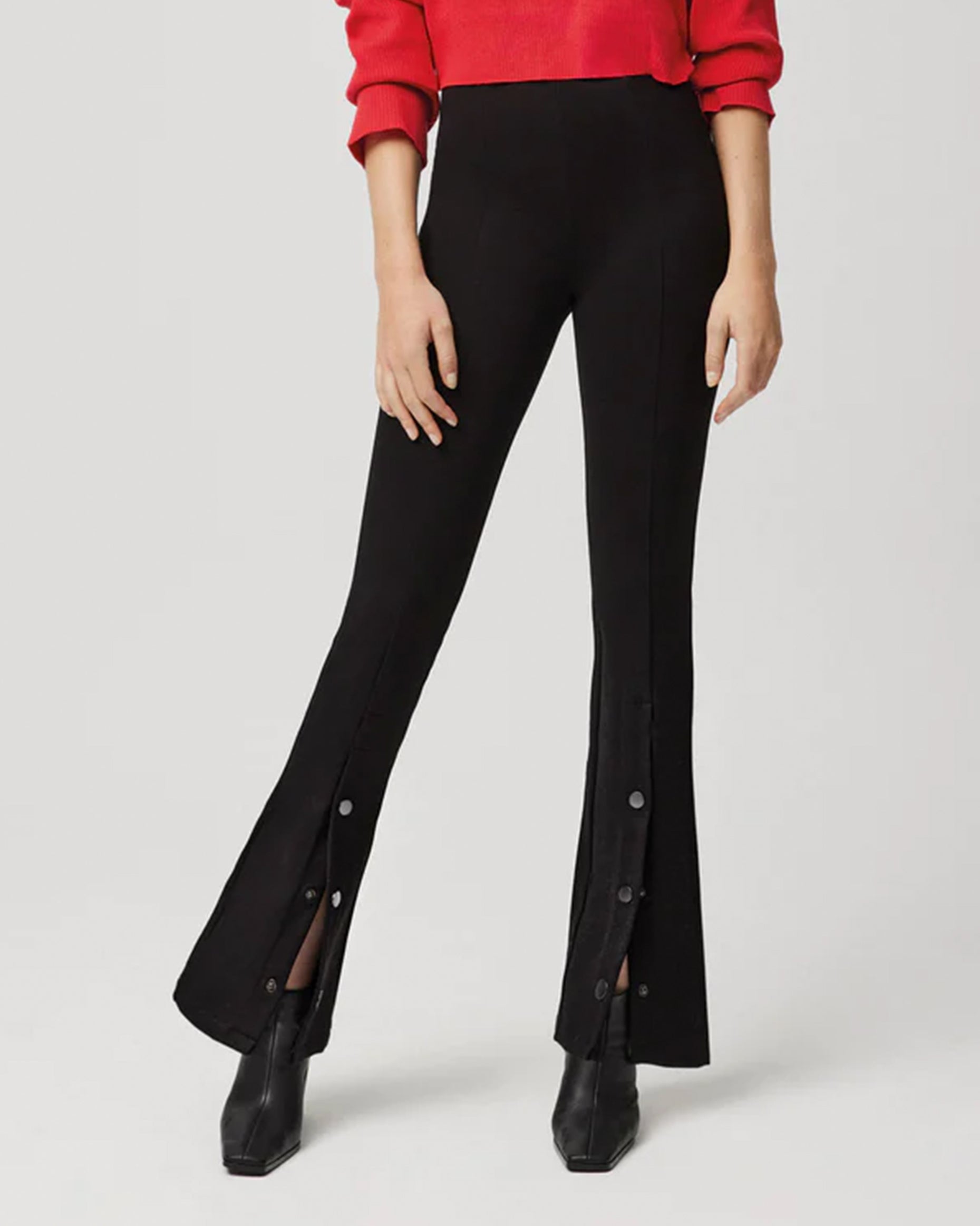 Ysabel Mora 70153 Flared Button Leggings - Black high waisted stretch trouser leggings (treggings) with split buttoned flare bottom. Worn with red sweater and black ankle boots.