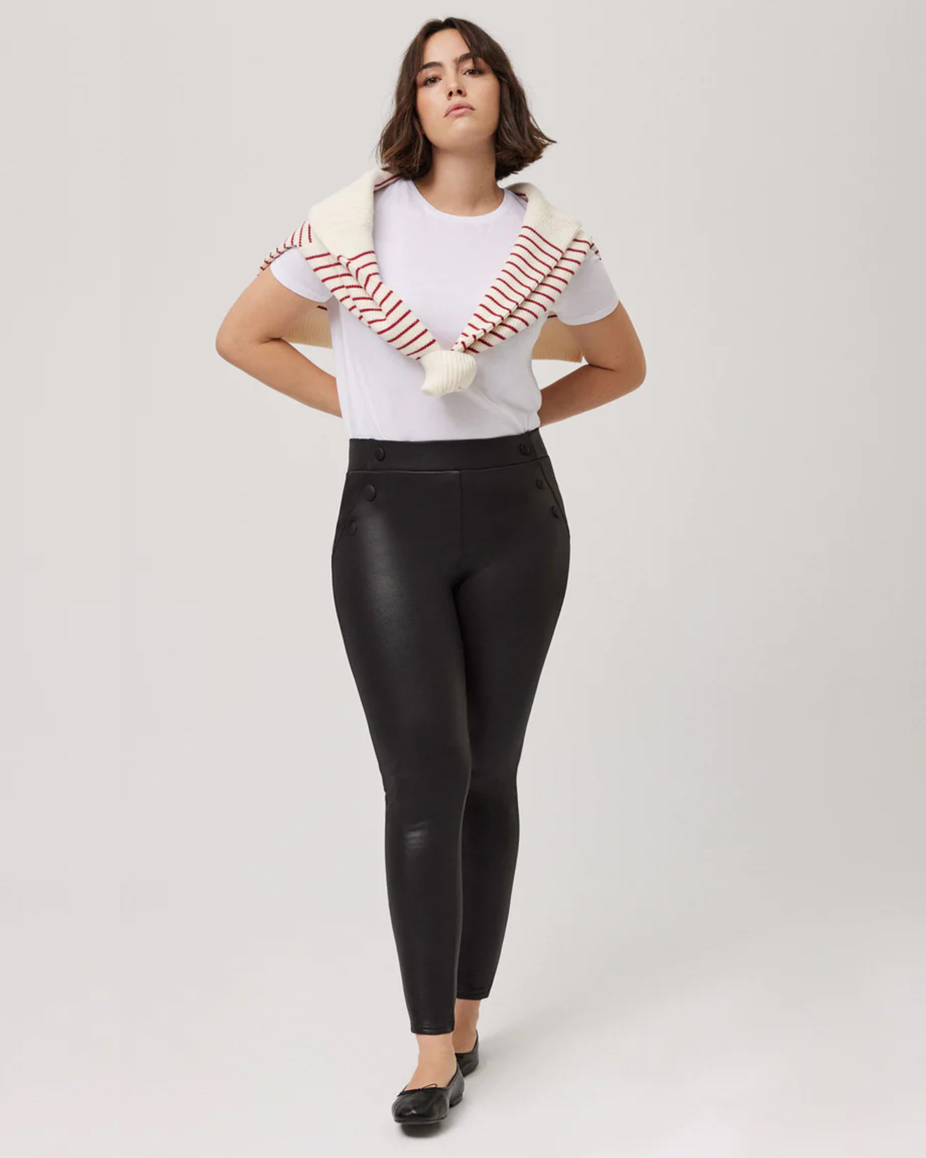 Ysabel Mora 70166 Waxed Thermal Leggings - High rise black trouser leggings with waxed effect finish, warm fleece lining, faux front pockets with covered buttons and deep elasticated waistband. Worn with a striped sweater and white t-shirt
