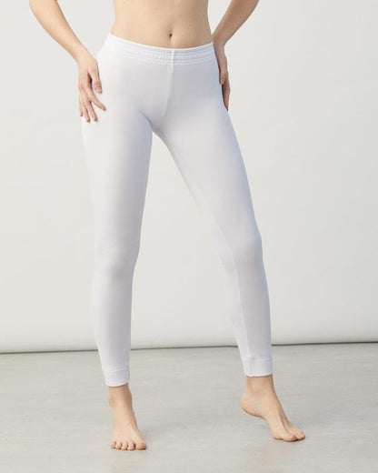 Person wearing white thermal fleece lined leggings on a plain background