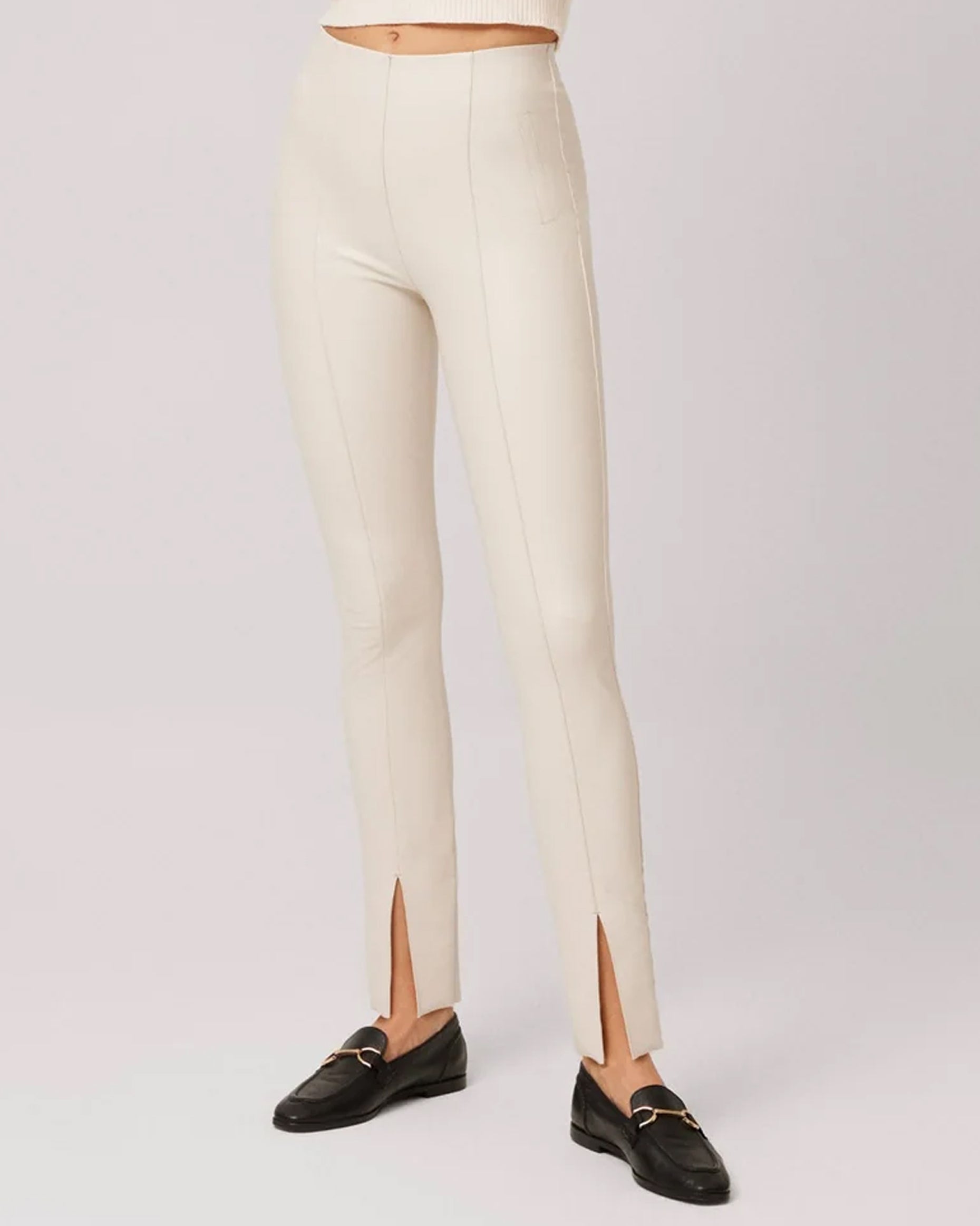 Ysabel Mora 70295 Faux Leather Slit Leggings - Tight fit faux leather thermal cream coloured leggings with a warm plush fleece lining, faux side pocket stitching, centre seam down the front of the leg with a slit opening at the cuff, worn with black loafers.