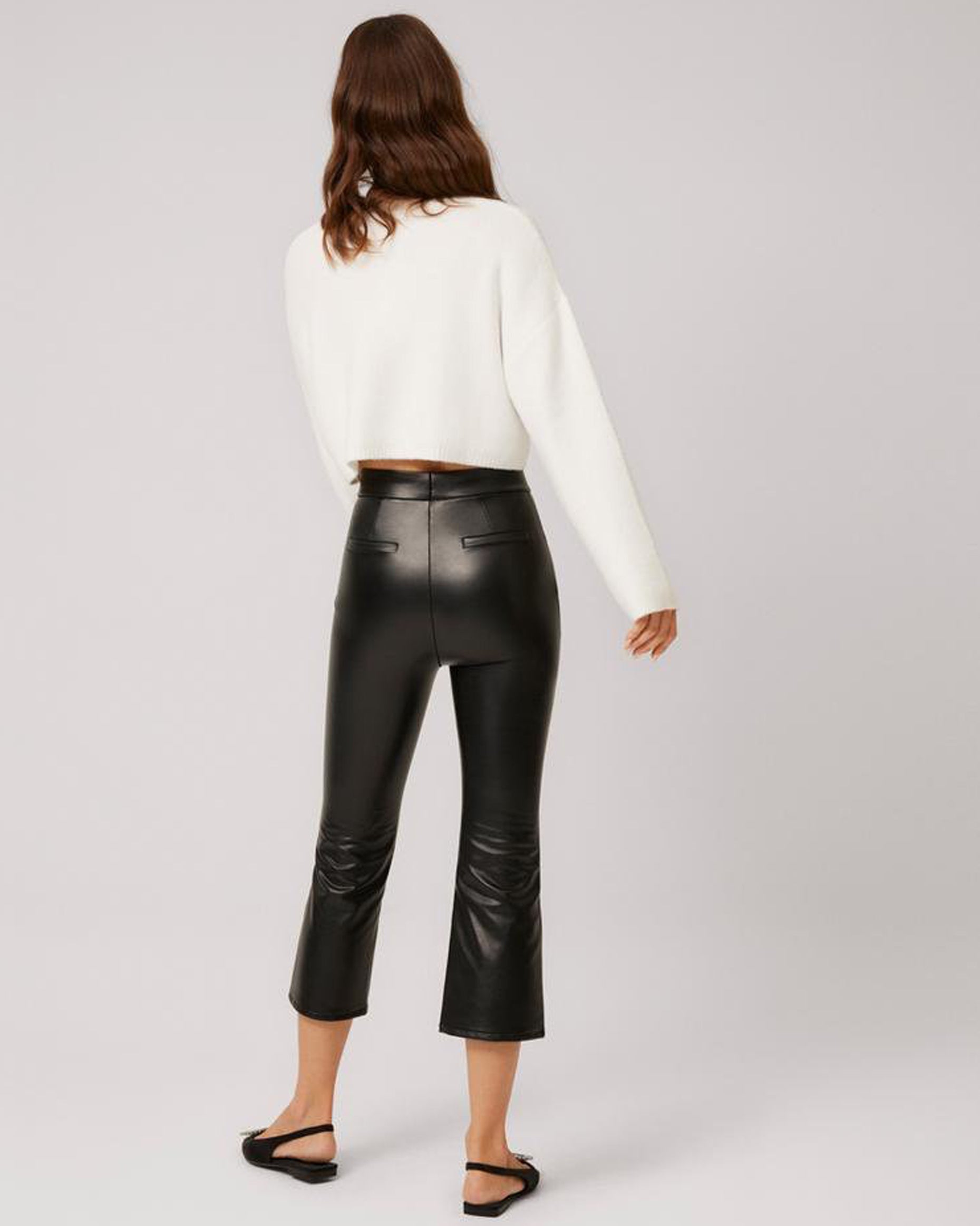 Ysabel Mora 70296 Faux Leather Cropped Pants - Black flared crop faux leather thermal leggings with a soft and warm plush lining. Worn with an off white knitted sweater and sling back pointed shoes..
