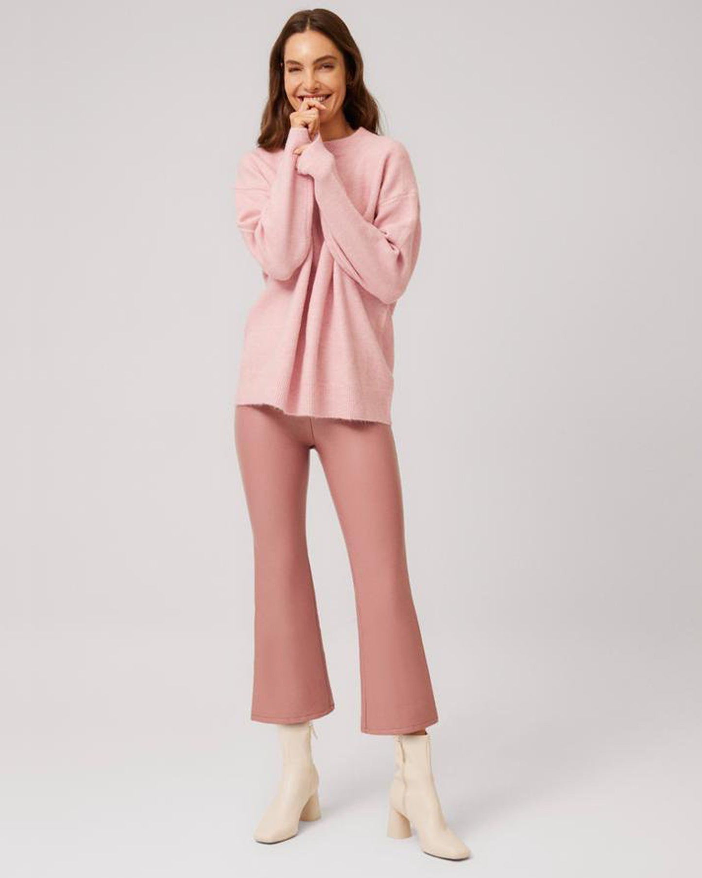 Ysabel Mora 70296 Faux Leather Cropped Pants - Pale dirty pink flared crop faux leather thermal leggings with a soft and warm plush lining. Worn with a light dusty pink knitted jumper and cream block heeled ankle boots.