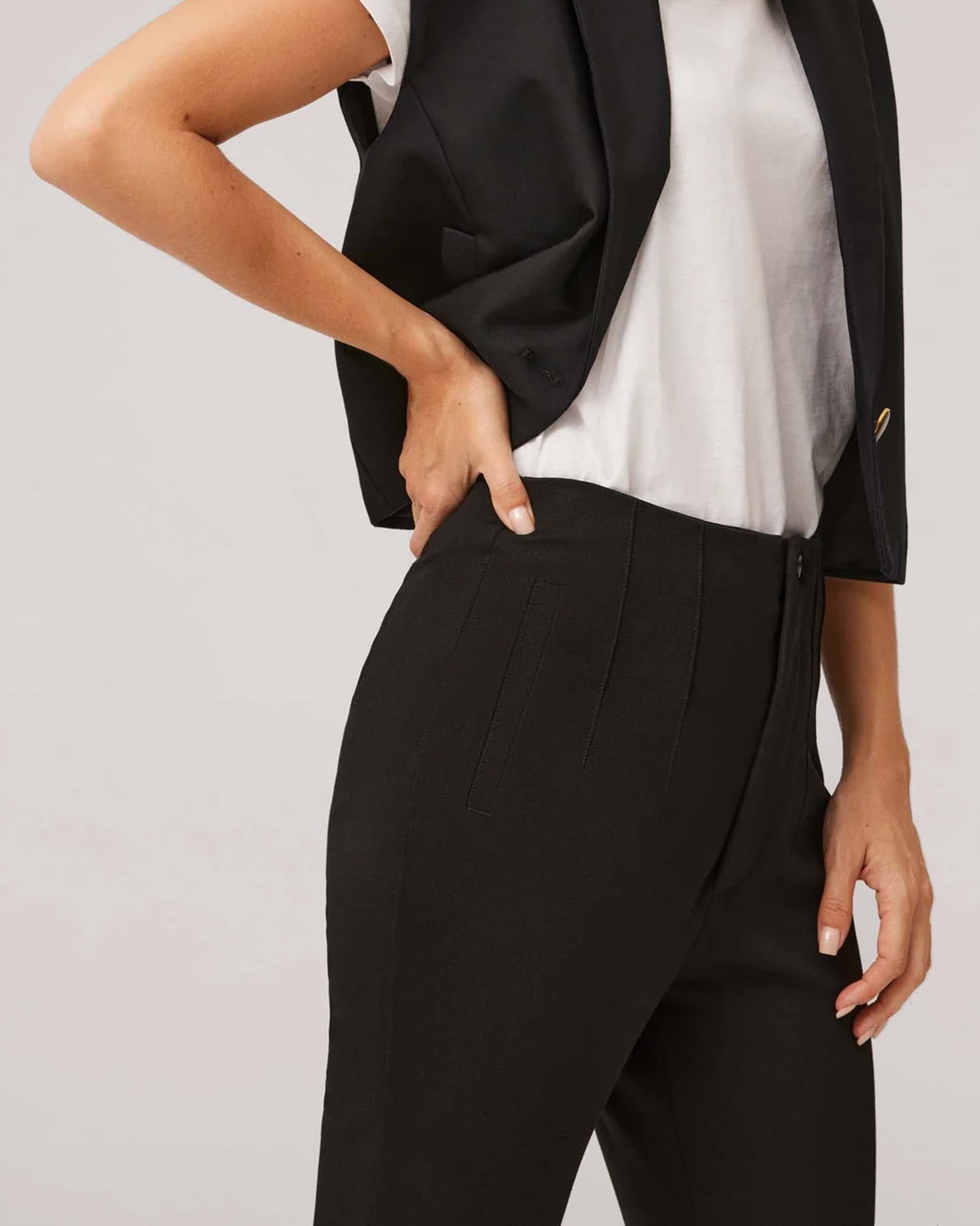 Ysabel Mora 70403 High Waist Trousers - Black suit style high waisted pants with pleated darts, invisible front zipper and button, worn with white t-shirt and waist coat.