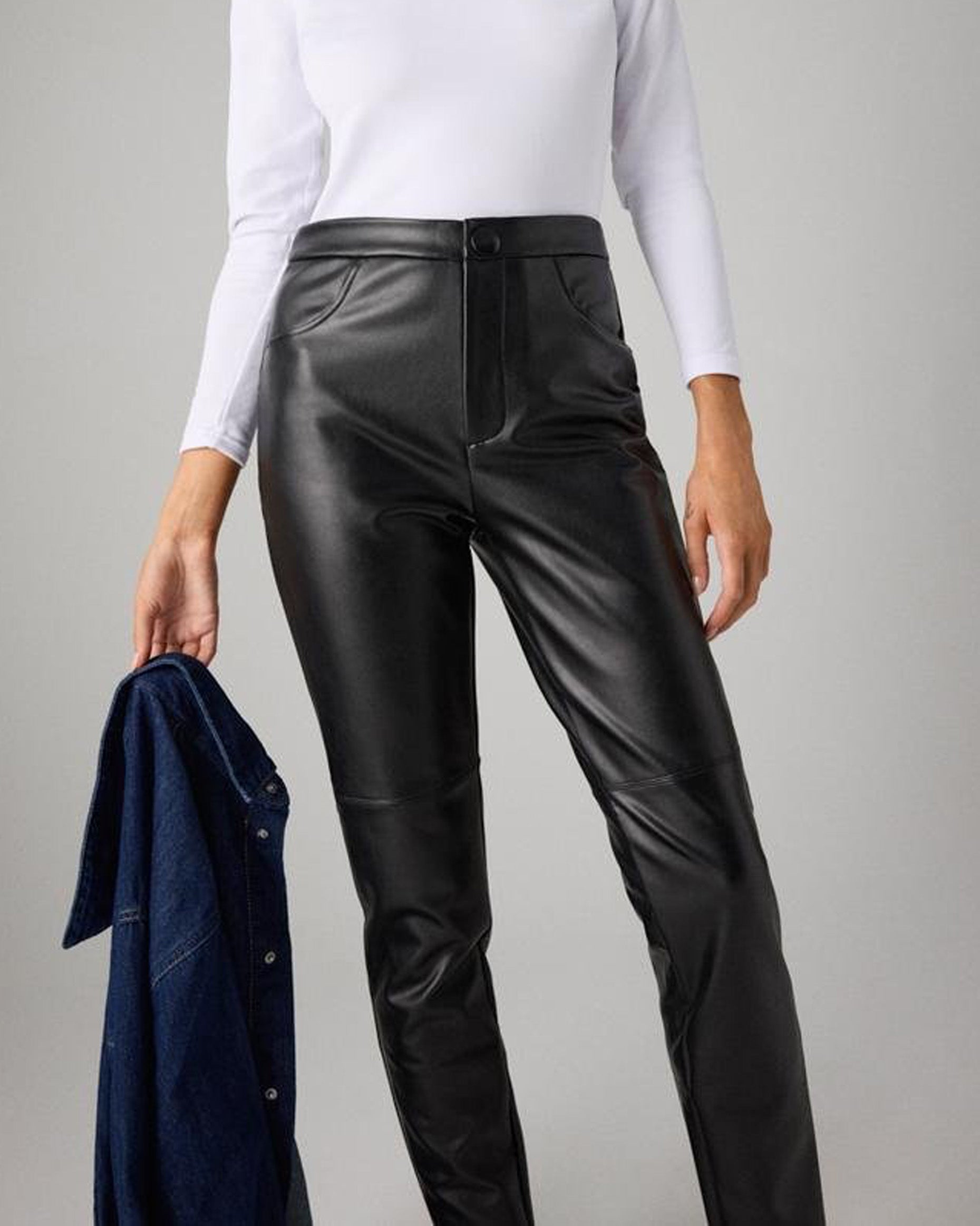 Ysabel Mora 70420 Faux Leather Pants - Black faux leather thermal relaxed fit trouser leggings with fly and button closure, faux front pocket stitching, tapered leg and soft, warm plush fleece lining. Close up.