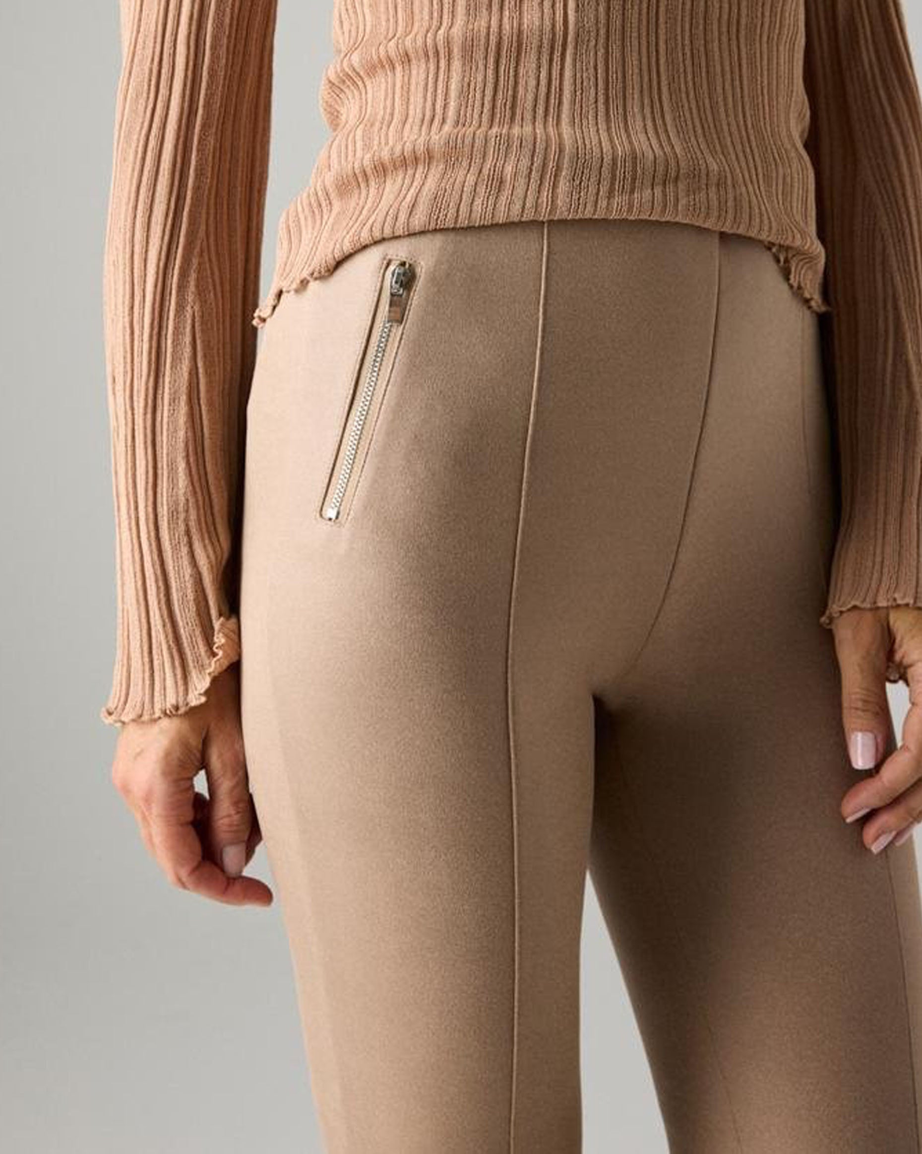 Ysabel Mora 7032 Faux Suede Leggings - Faux suede effect jodhpur style trousers leggings in a light beige shade, with silver zipped faux front pockets, front raised seam down the front of the legs, back pockets and tapered legs. Detail